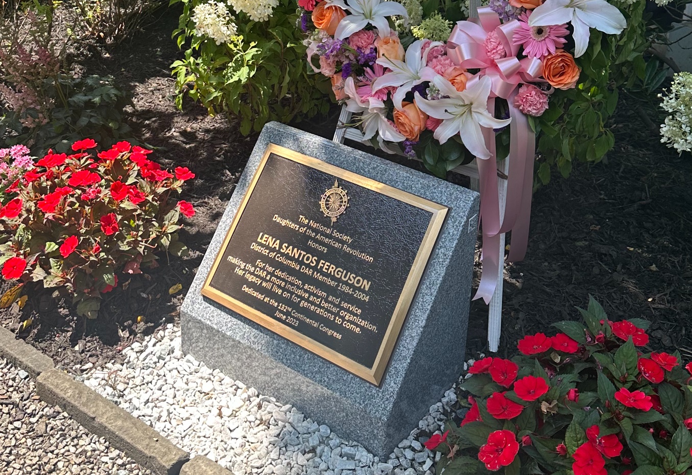 Memorial plaque honoring Lena Santos Ferguson in the garden beside DAR Constitution Hall.